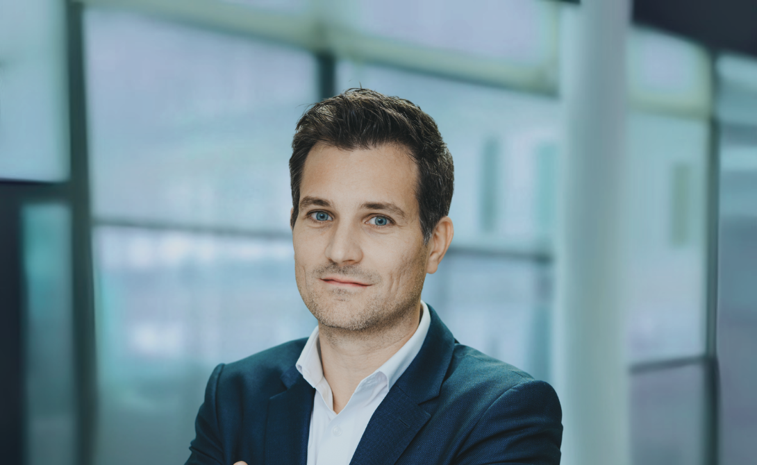 Portrait of a confident businessman in a modern office environment – CONVOTIS expert