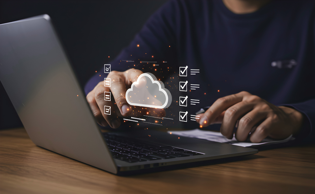 User managing cloud migration tasks on a laptop – visualizing checklist-based planning and execution of cloud infrastructure deployment.