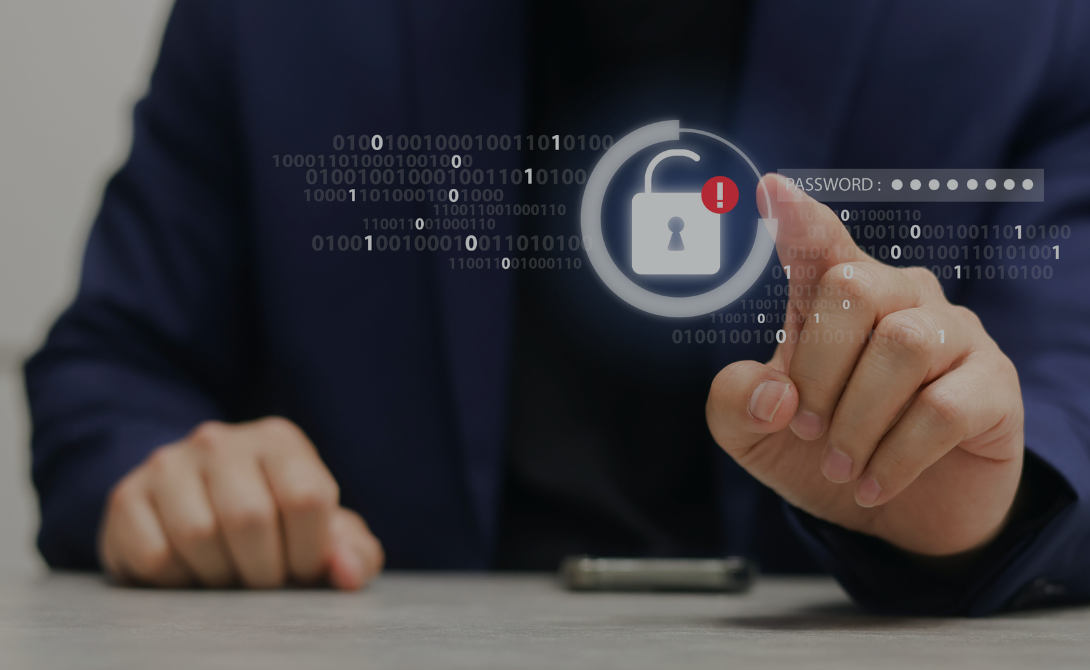 Businessperson touching a virtual padlock icon with a password field – symbolizing ransomware threats and the importance of proactive cybersecurity measures.