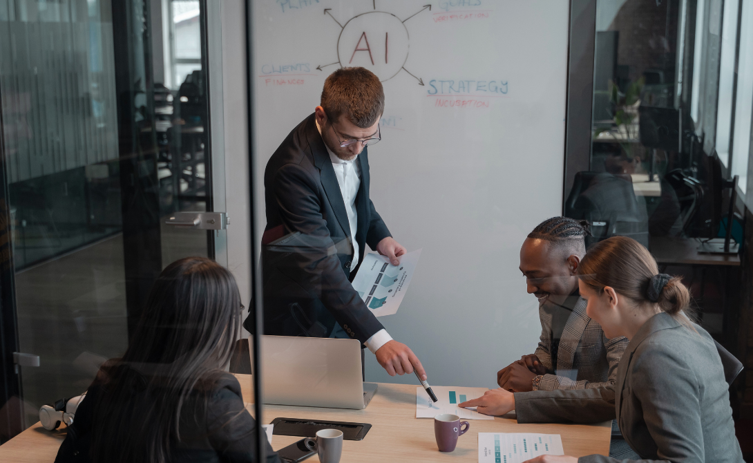 Business team analyzing data analytics and reporting dashboards with AI-driven insights in a modern meeting room