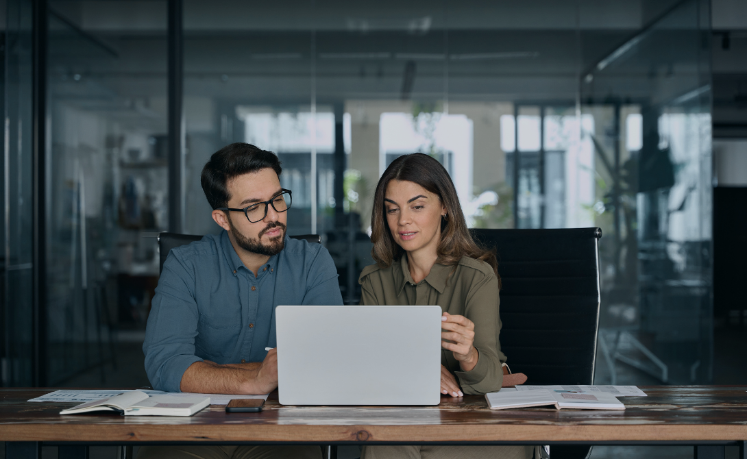 HR professionals collaborating on workforce solutions – leveraging HR services for efficient employee management