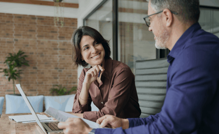 Business professionals discussing IT security solutions – symbolizing strategic Security Consulting and Zero Trust architecture planning.