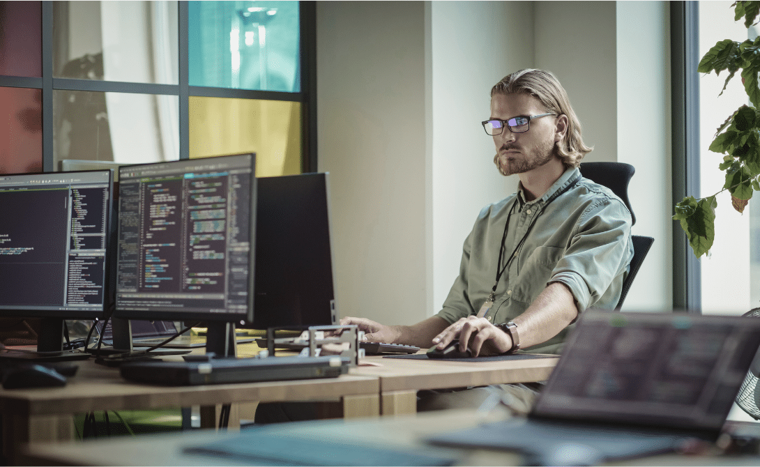 IT specialist working on open-source cloud migration in a secure development environment.