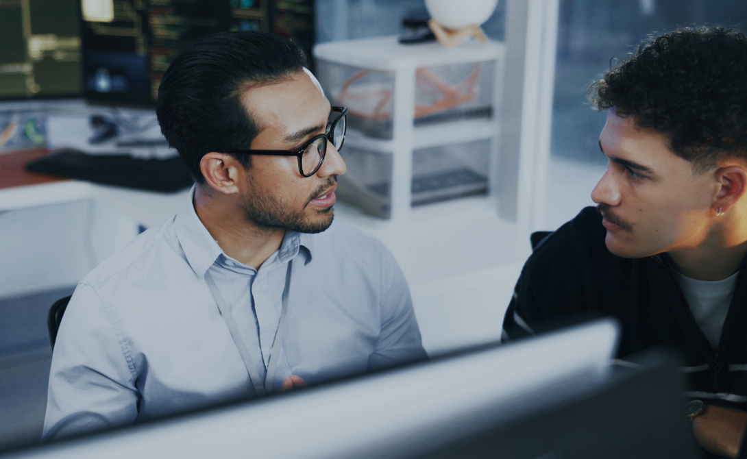 Security consulting experts discussing cybersecurity strategies and risk management in a professional consulting environment